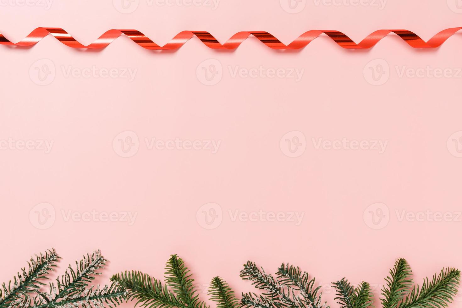Minimal creative flat lay of christmas traditional composition and new year holiday season. Top view winter christmas decorations on pink background with blank space for text. Copy space photography. photo