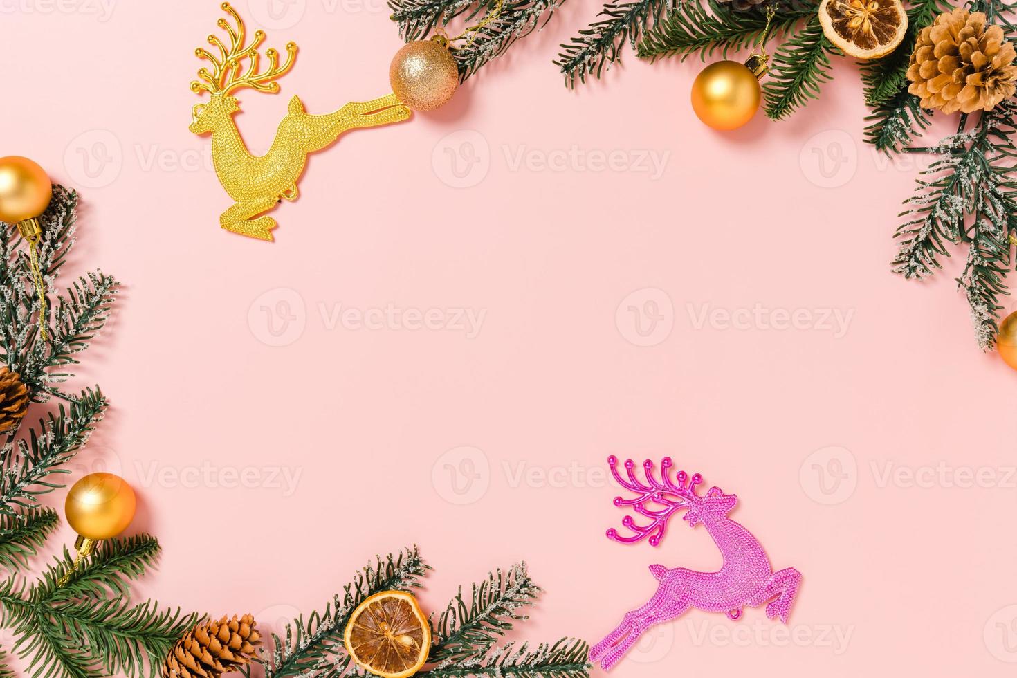 Minimal creative flat lay of christmas traditional composition and new year holiday season. Top view winter christmas decorations on pink background with blank space for text. Copy space photography. photo