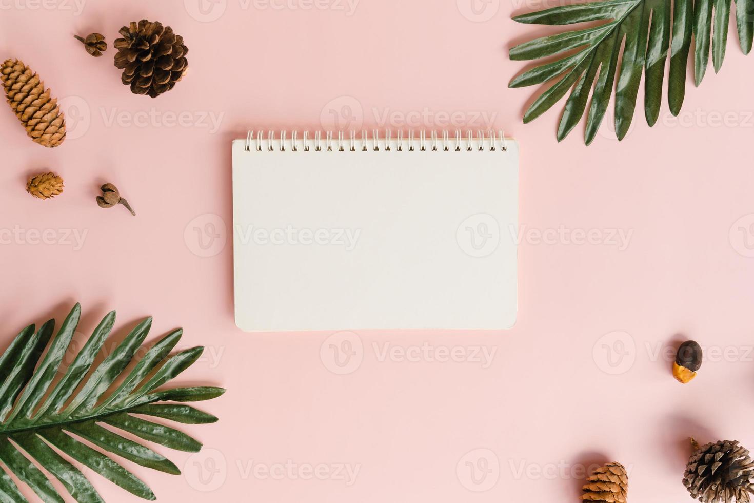 Creative flat lay of travel vacation spring or summer tropical fashion. Top view beach accessories open mockup black notebook for text on pastel background. Top view mock up copy space photography. photo