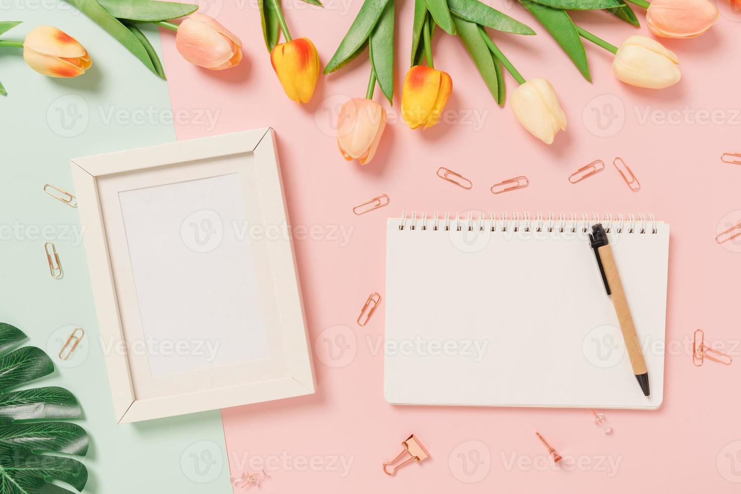 Creative flat lay of travel vacation spring or summer tropical fashion. Top view beach accessories open mockup black notebook for text on pastel background. Top view mock up copy space photography. photo