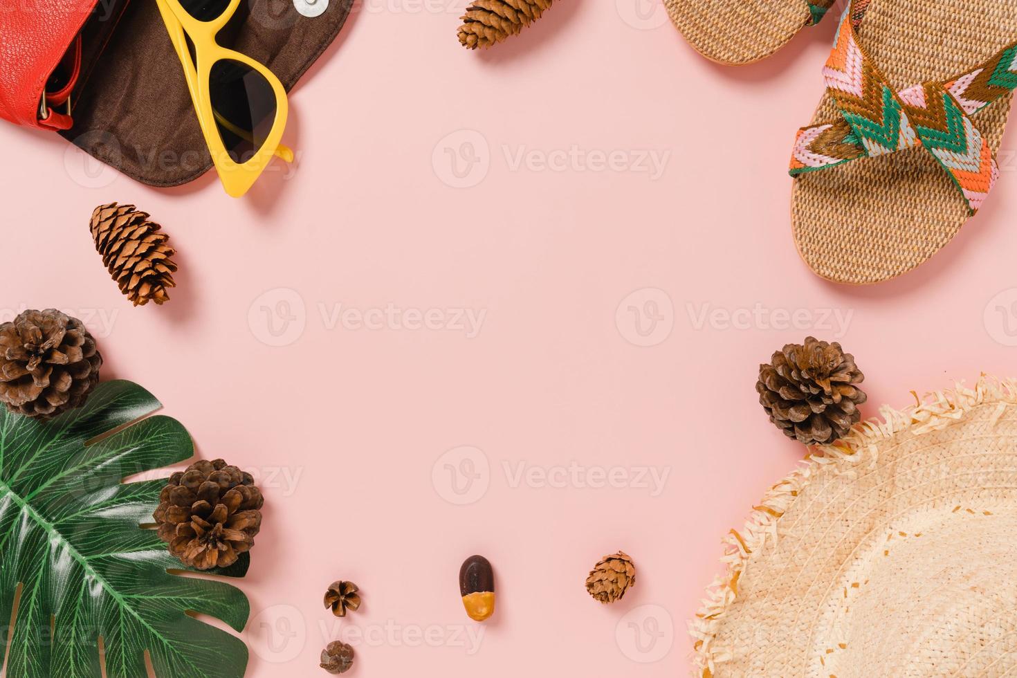 Creative flat lay photo of travel vacation spring or summer tropical fashion. Top view beach accessories on pastel pink color background with blank space for text. Top view copy space photography.