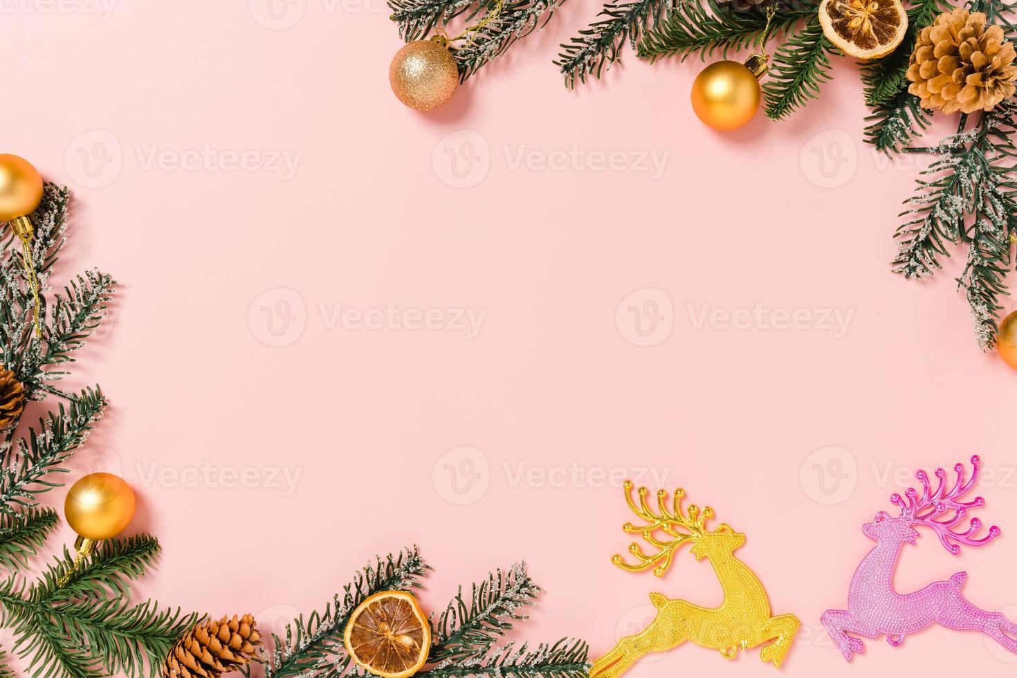 Minimal creative flat lay of christmas traditional composition and new year holiday season. Top view winter christmas decorations on pink background with blank space for text. Copy space photography. photo