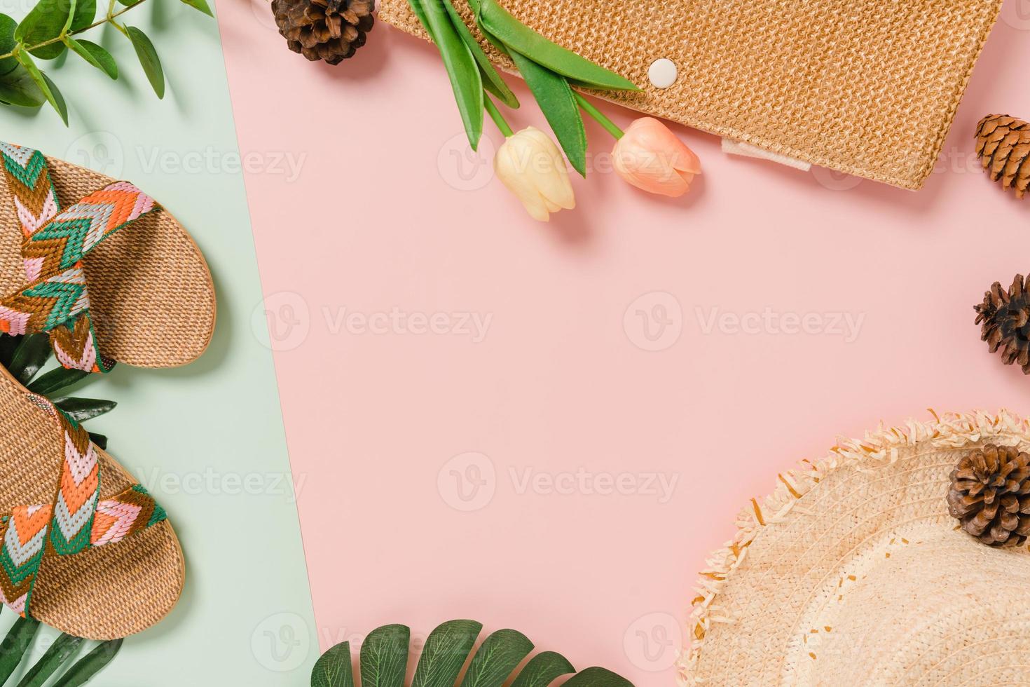 Creative flat lay of travel vacation spring or summer tropical fashion. Top view beach accessories on pastel green pink color background with blank space for text. Top view copy space photography. photo