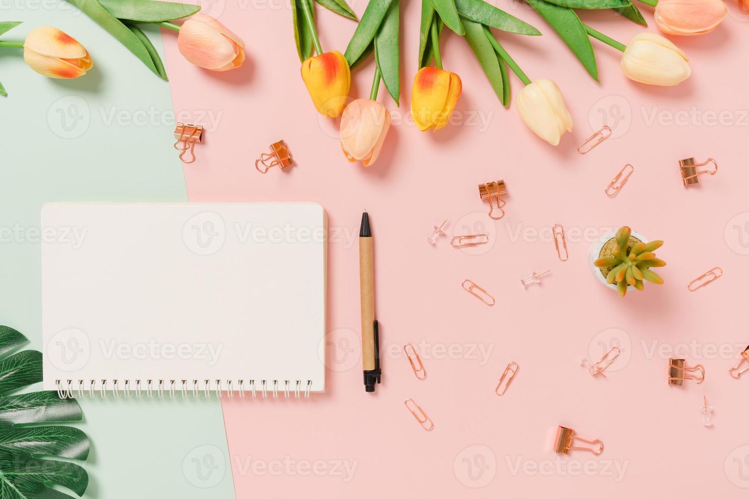 Creative flat lay of travel vacation spring or summer tropical fashion. Top view beach accessories open mockup black notebook for text on pastel background. Top view mock up copy space photography. photo