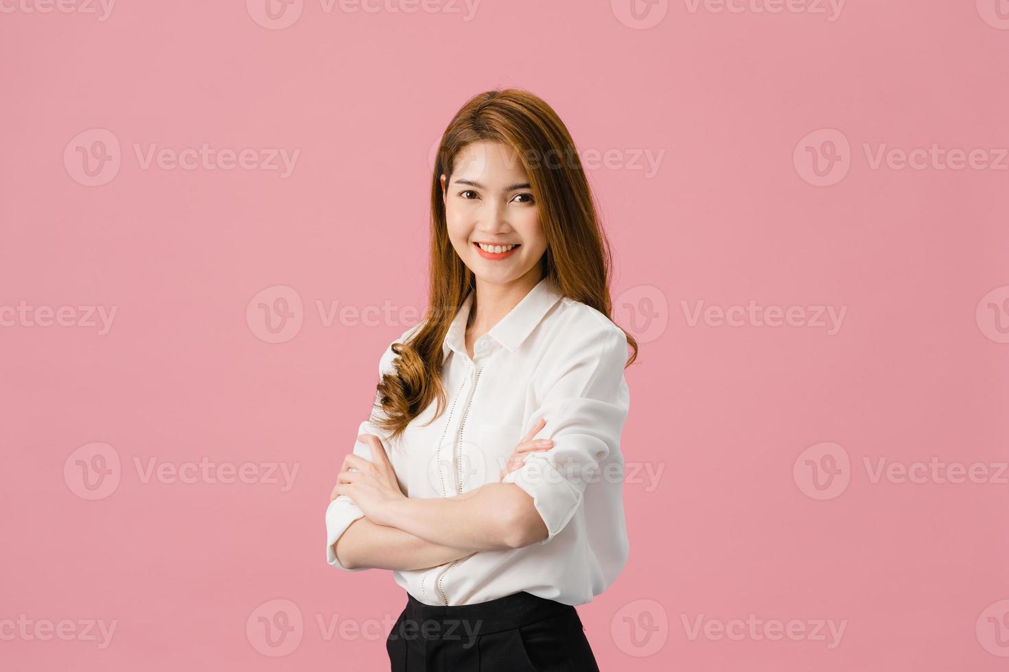 Portrait of young Asia lady with positive expression, arms crossed, smile broadly, dressed in casual clothing and looking at camera over pink background. Happy adorable glad woman rejoices success. photo