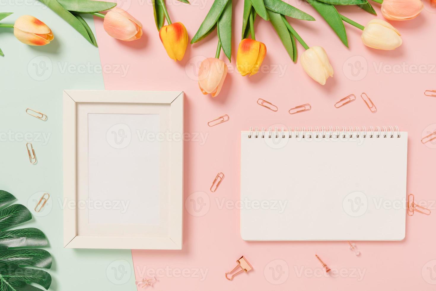 Creative flat lay of travel vacation spring or summer tropical fashion. Top view beach accessories open mockup black notebook for text on pastel background. Top view mock up copy space photography. photo