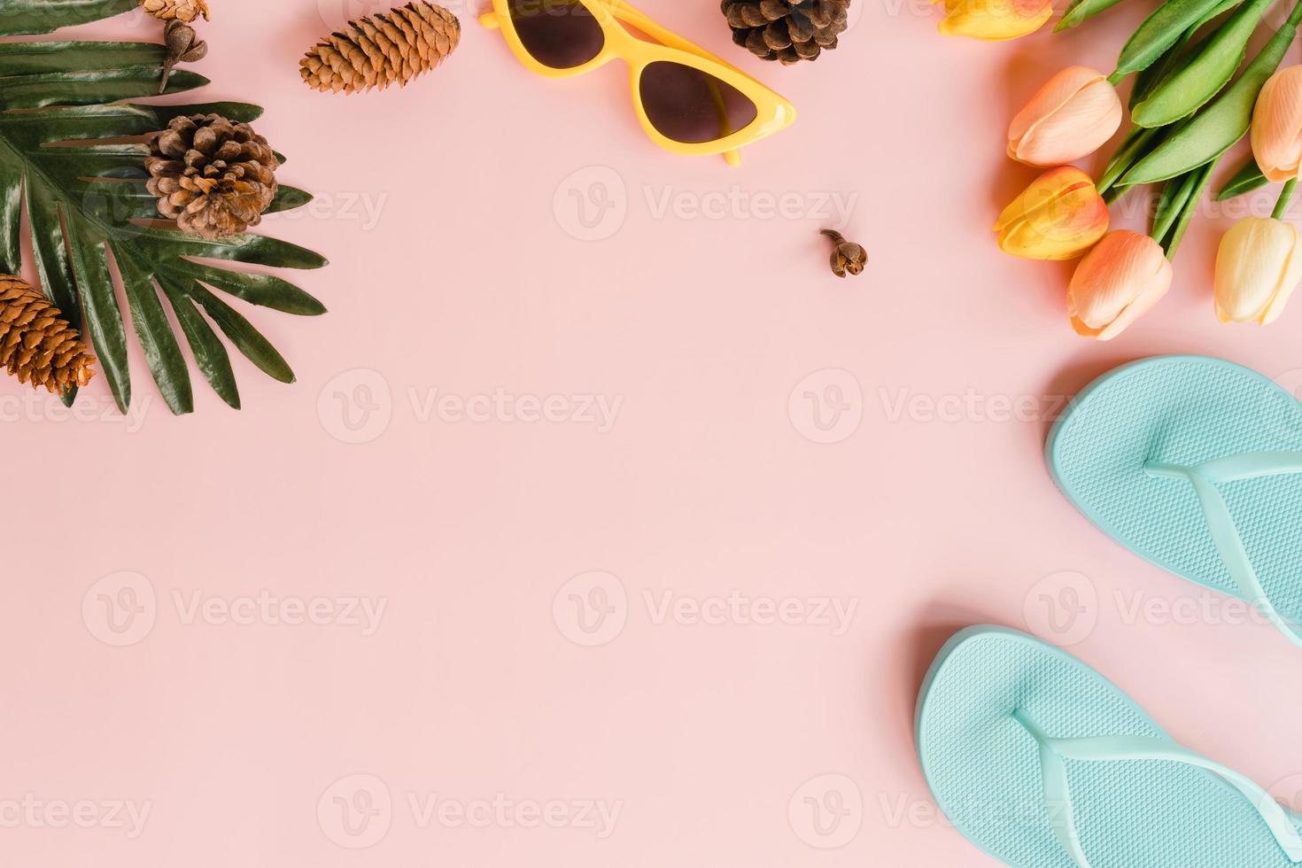 Creative flat lay photo of travel vacation spring or summer tropical fashion. Top view beach accessories on pastel pink color background with blank space for text. Top view copy space photography.