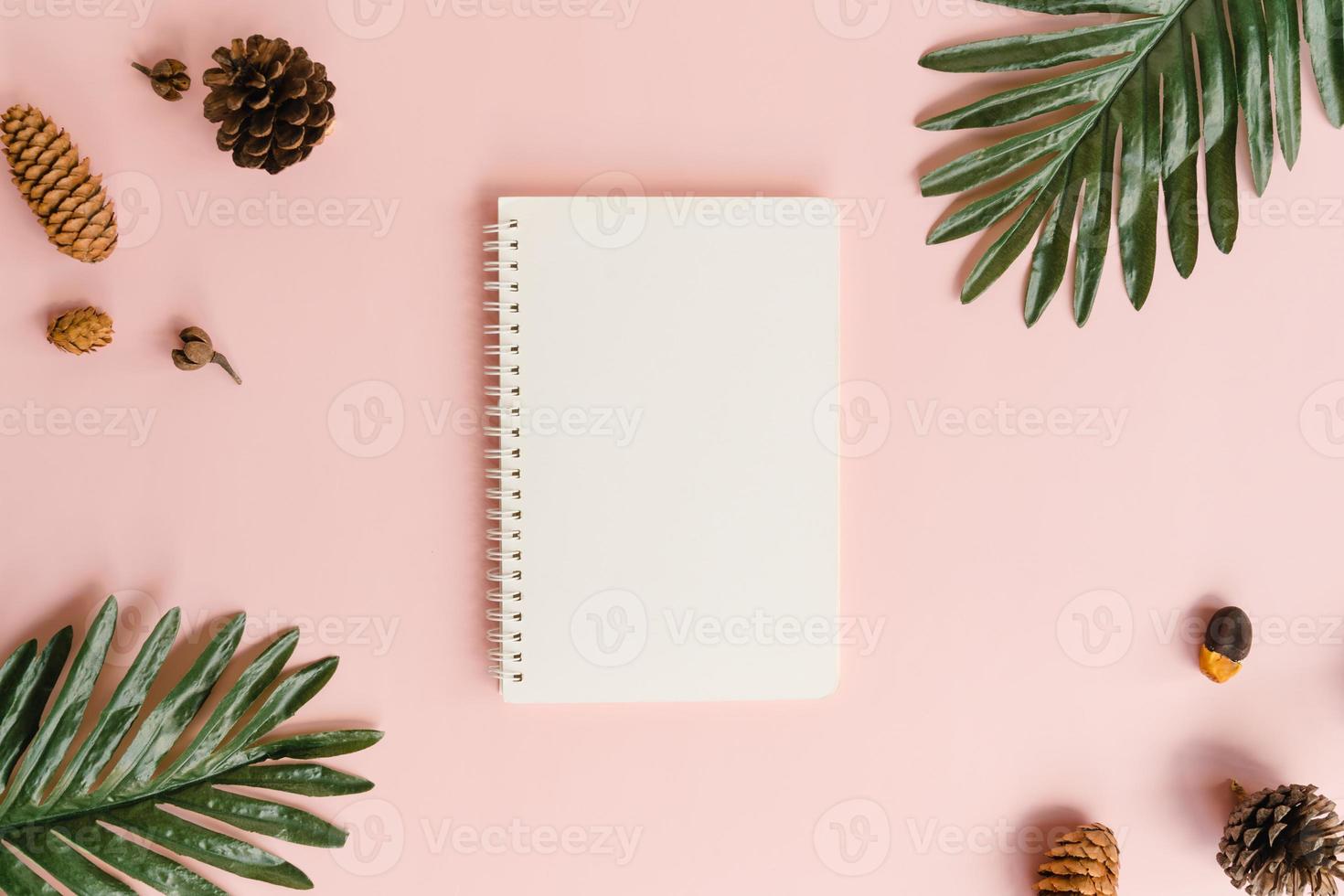 Creative flat lay of travel vacation spring or summer tropical fashion. Top view beach accessories open mockup black notebook for text on pastel background. Top view mock up copy space photography. photo