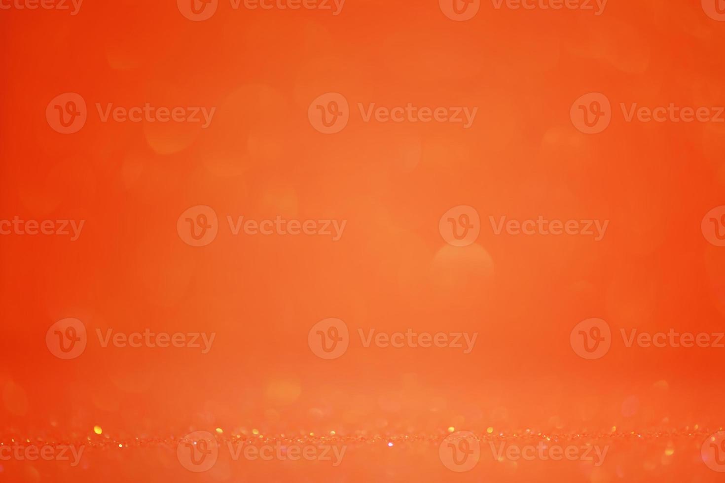 Orange background glitter defocus and narrow focal part. Festive background. photo