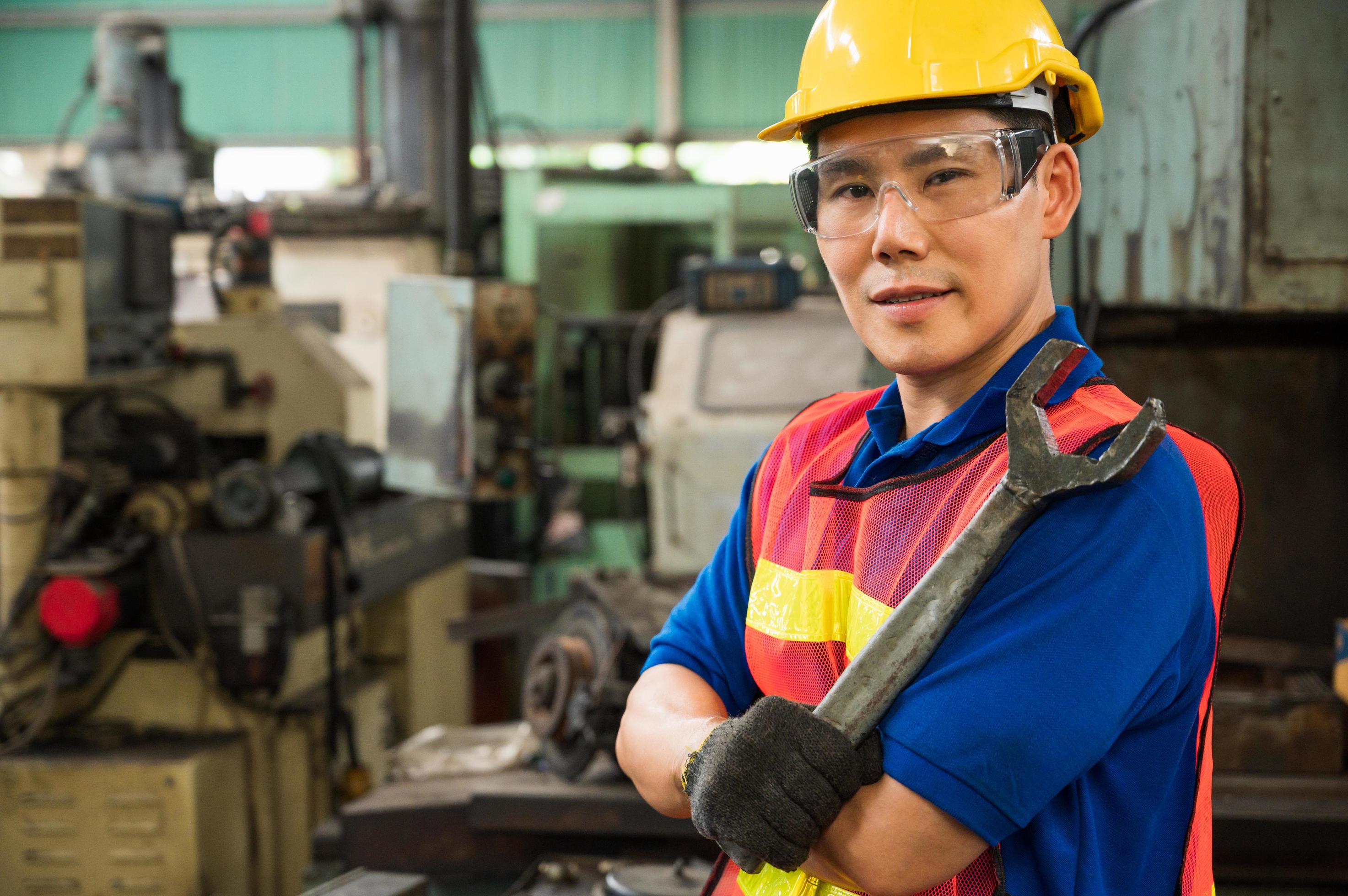 Asian Industrial workers are working on projects in large industrial