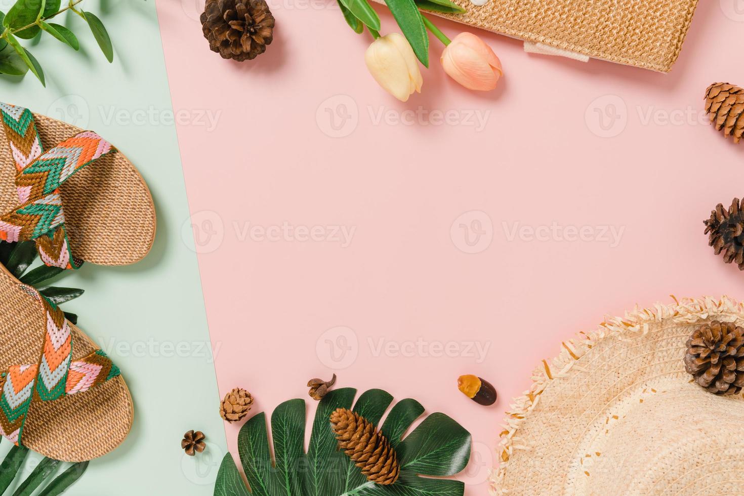 Creative flat lay of travel vacation spring or summer tropical fashion. Top view beach accessories on pastel green pink color background with blank space for text. Top view copy space photography. photo