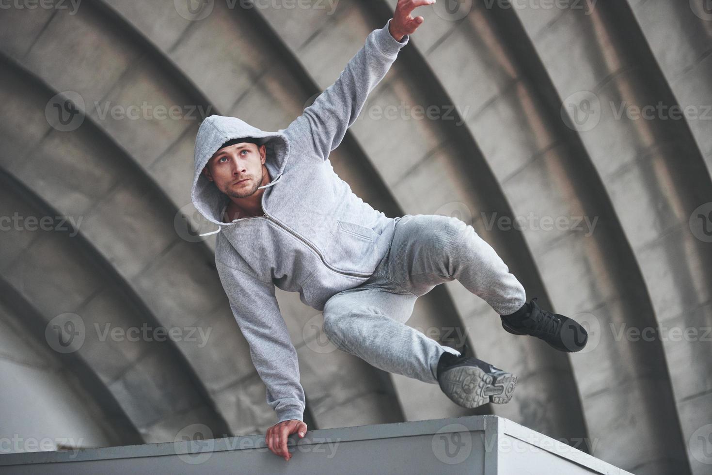 The guy in the park in the open air practices parks, high adrenaline. photo