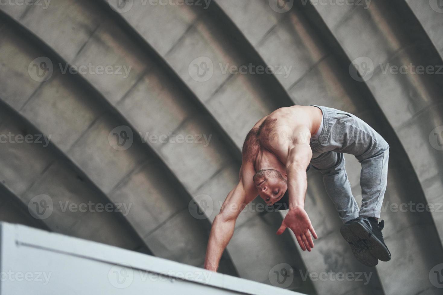 The guy in the park in the open air practices parks, high adrenaline. photo