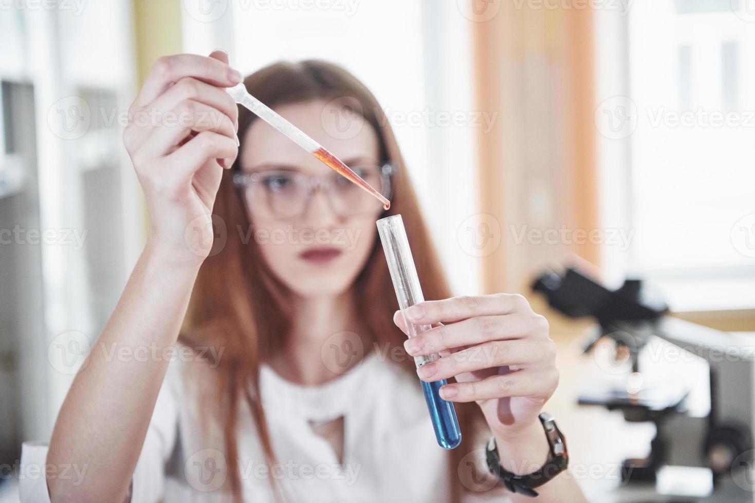 Experiments in the chemical laboratory. An experiment was carried out in a laboratory in transparent flasks photo