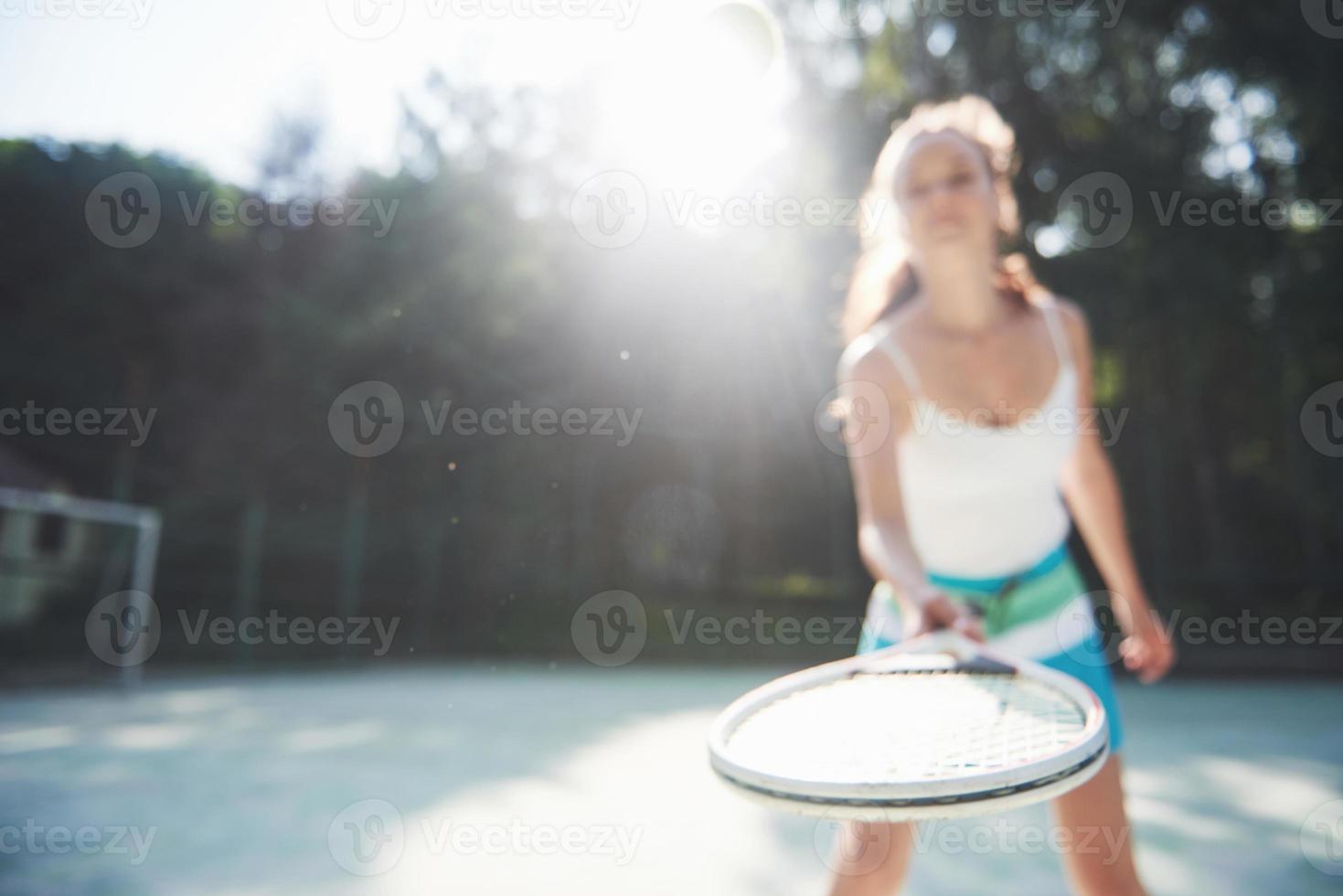 A pretty woman wearing a sportswear tennis court on the court photo