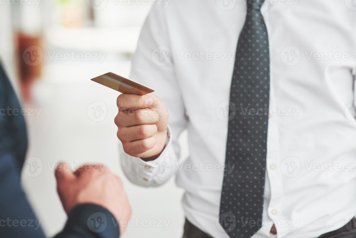 plastic card in the hands of a man photo