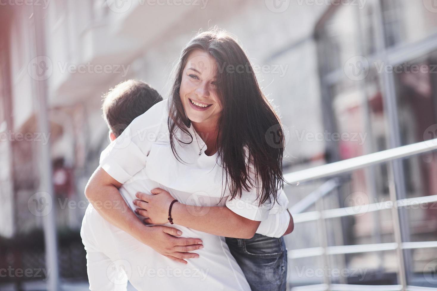 Beautiful happy couple hugging on the city street.Lifestyle concept love and romance photo