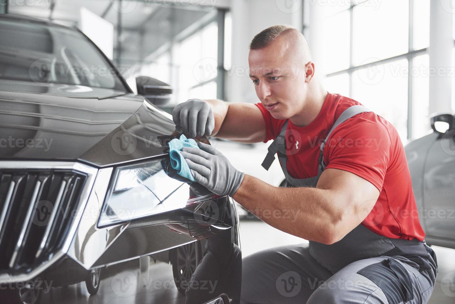 Professional cleaning and car wash in the car showroom photo