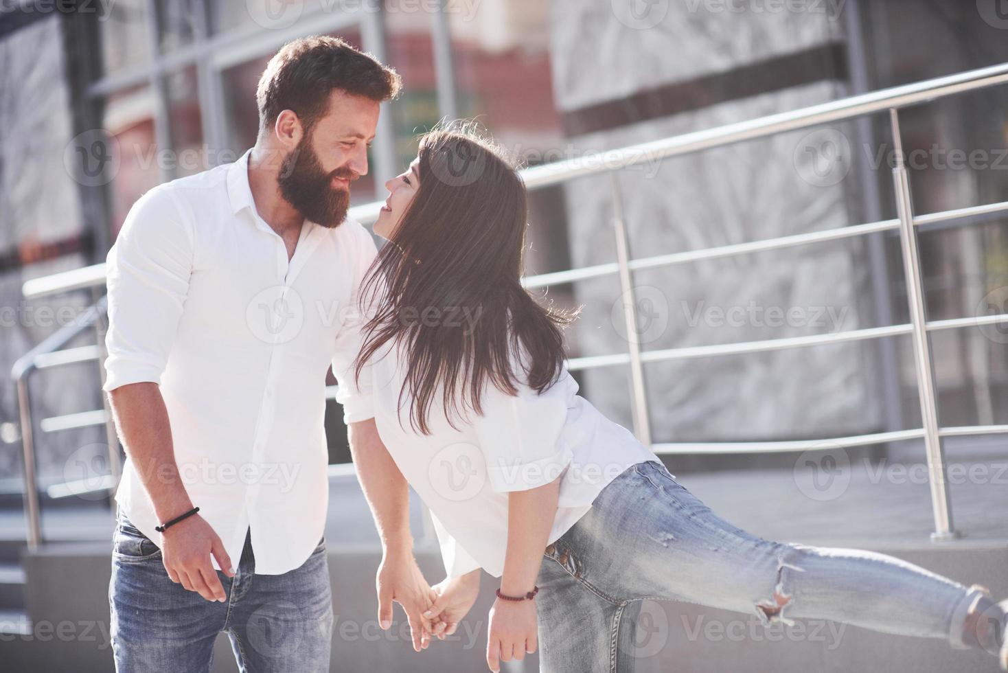 Beautiful happy couple hugging on the city street.Lifestyle concept love and romance photo