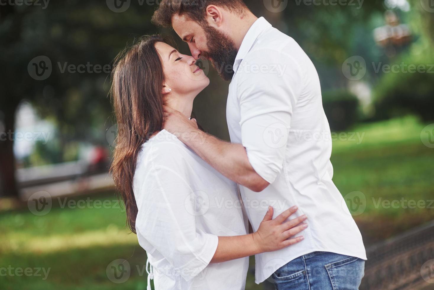 Romantic couple enyojing in moments of happiness in the park. Lifestyle concept love and tenderness photo