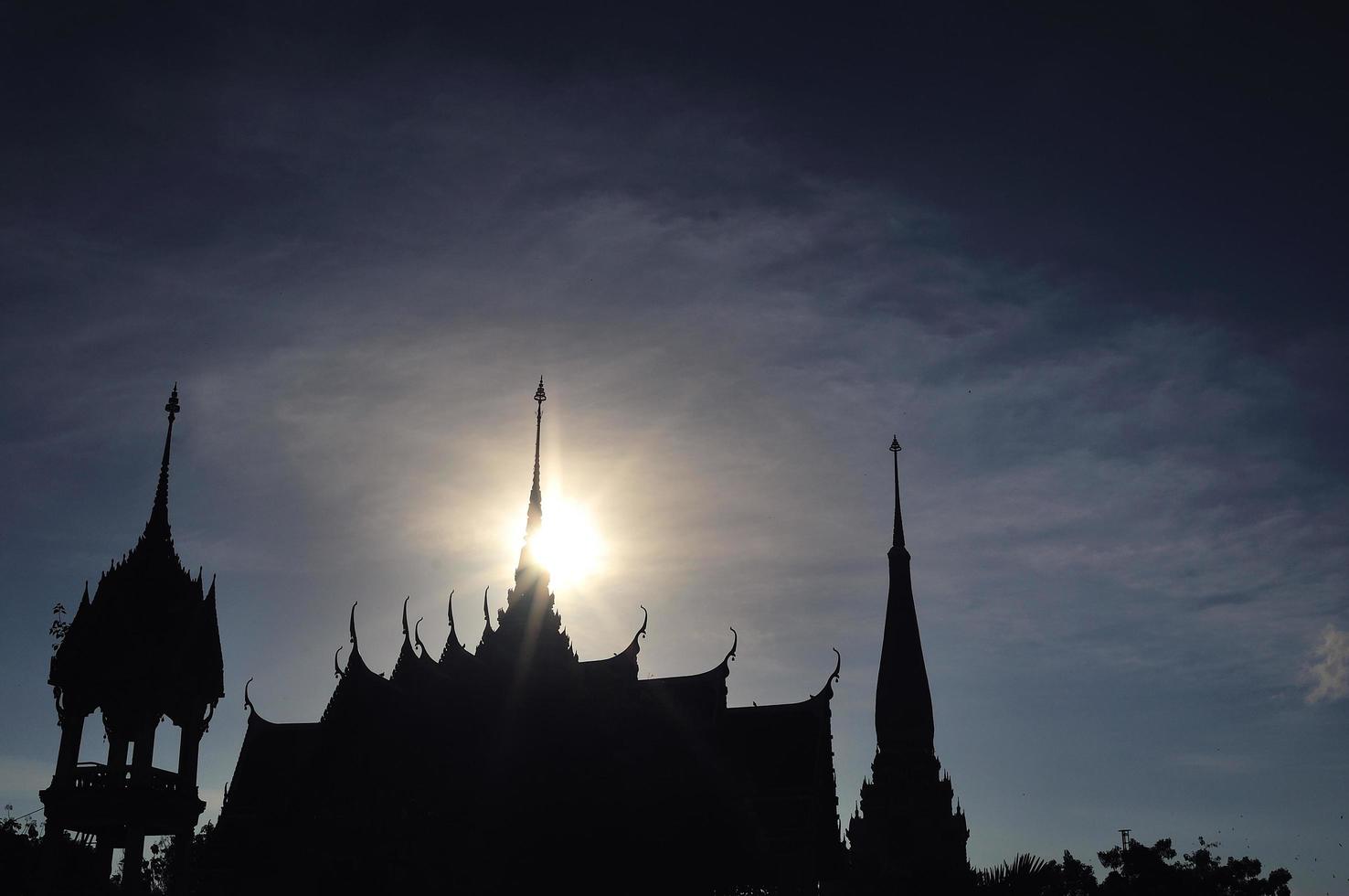 Silhouette Pagoda in Wat Chalong or Chaitharam temple in Phuket, thailand photo