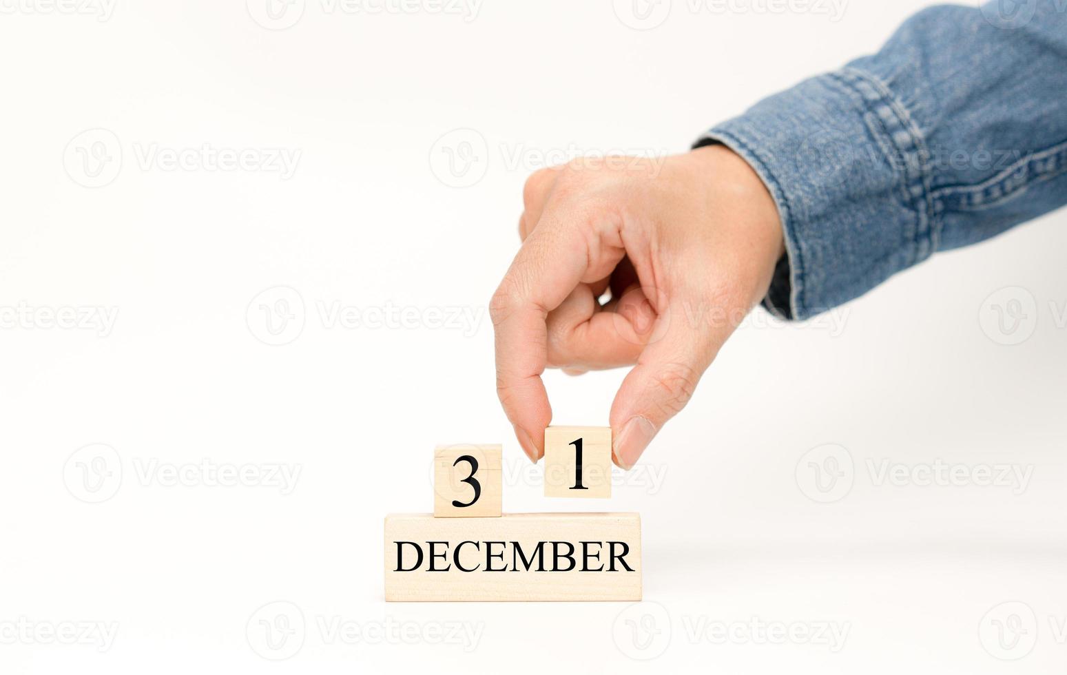 Hand put number 1 for date in December 31 of the last day for year photo