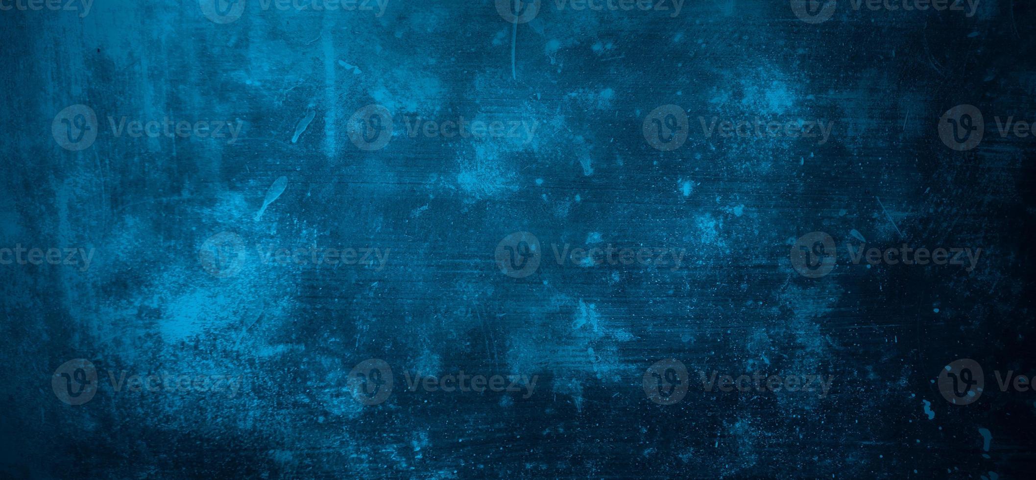 Blue wall background. The dark blue walls are scary. Scratched blue cement photo