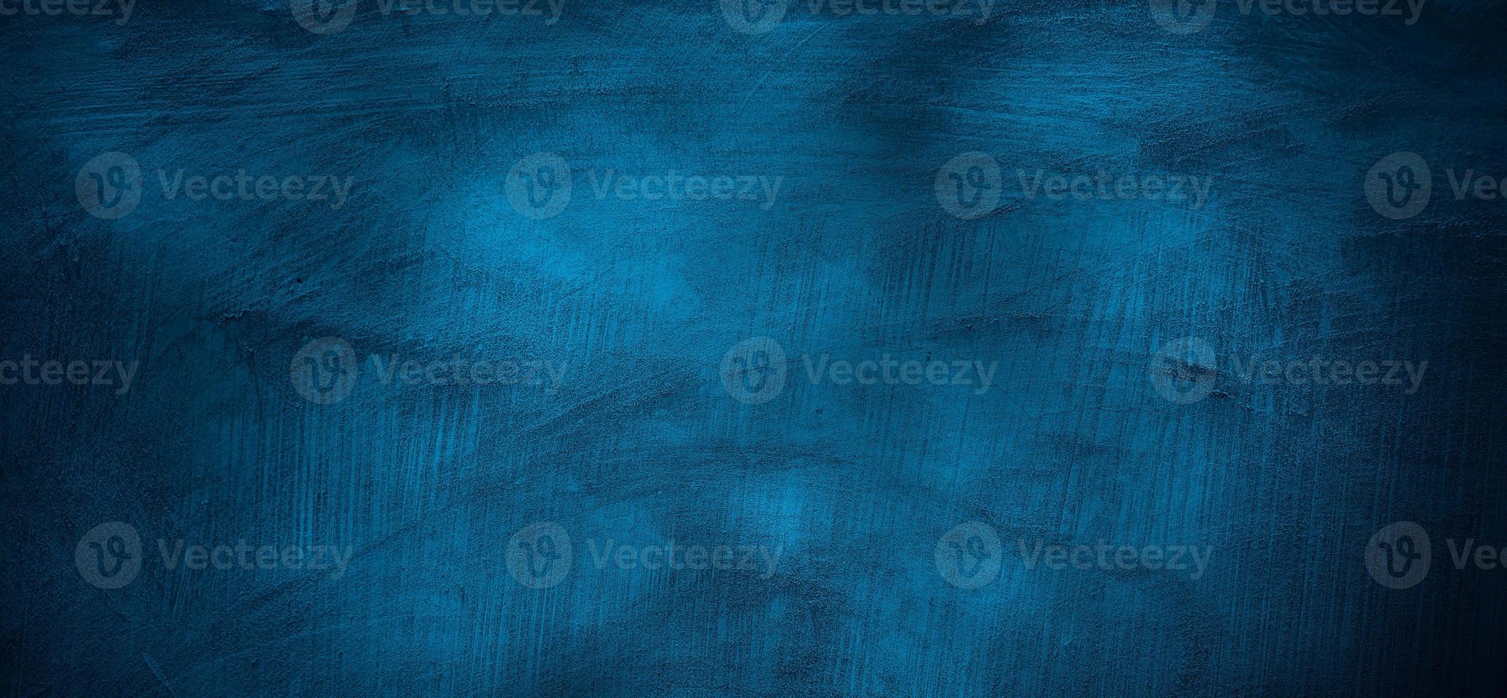 Blue wall background. The dark blue walls are scary. Scratched blue cement photo