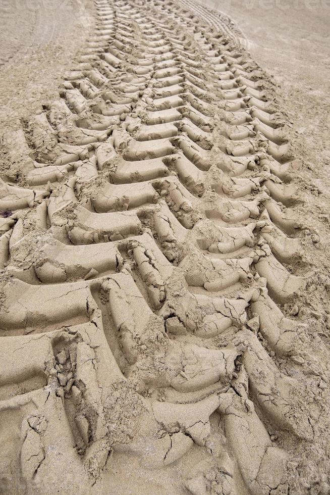 Wheel tracks on the beach photo