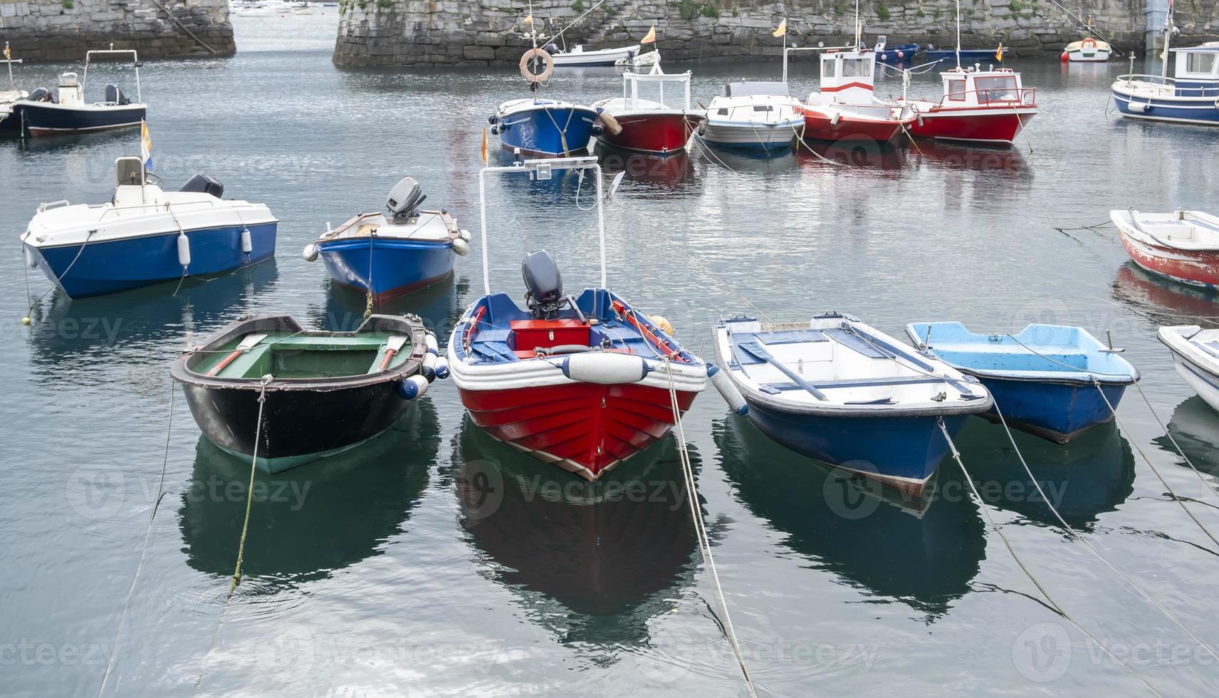 Boats moored at a dock photo