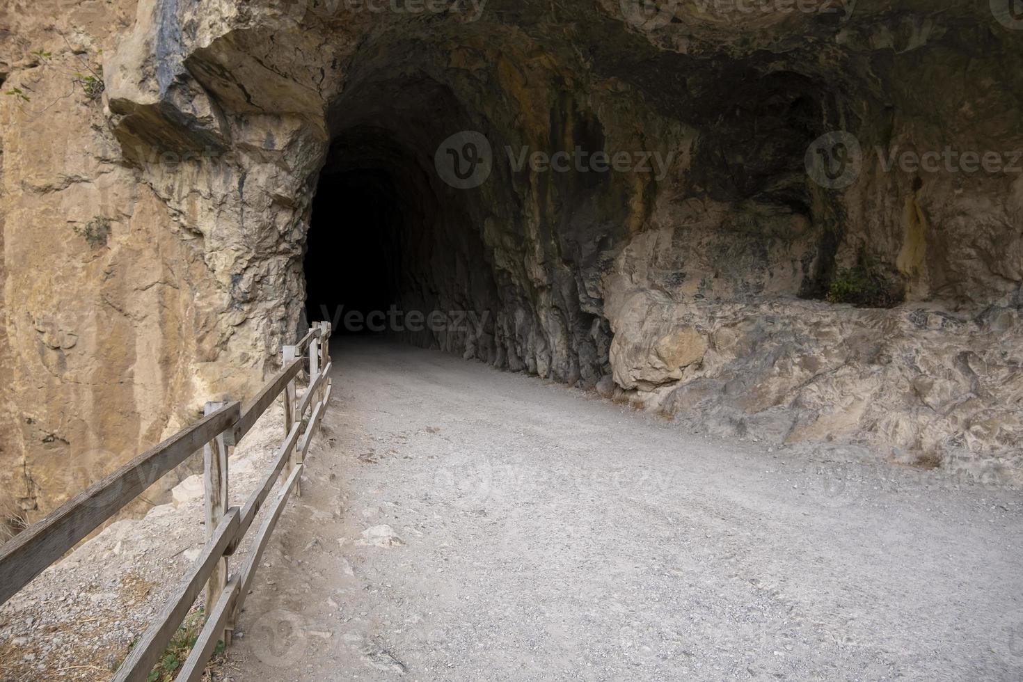 Dark tunnel in the stone photo