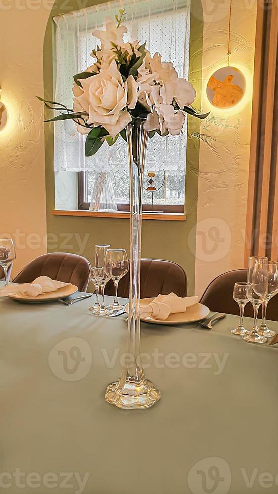 Festive table setting in the restaurant. Wedding preparations. Selective focus. photo