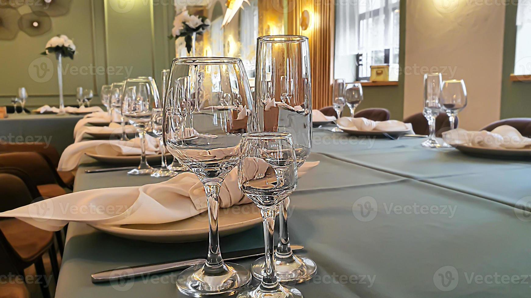 Festive table setting in the restaurant. Wedding preparations. Selective focus. photo