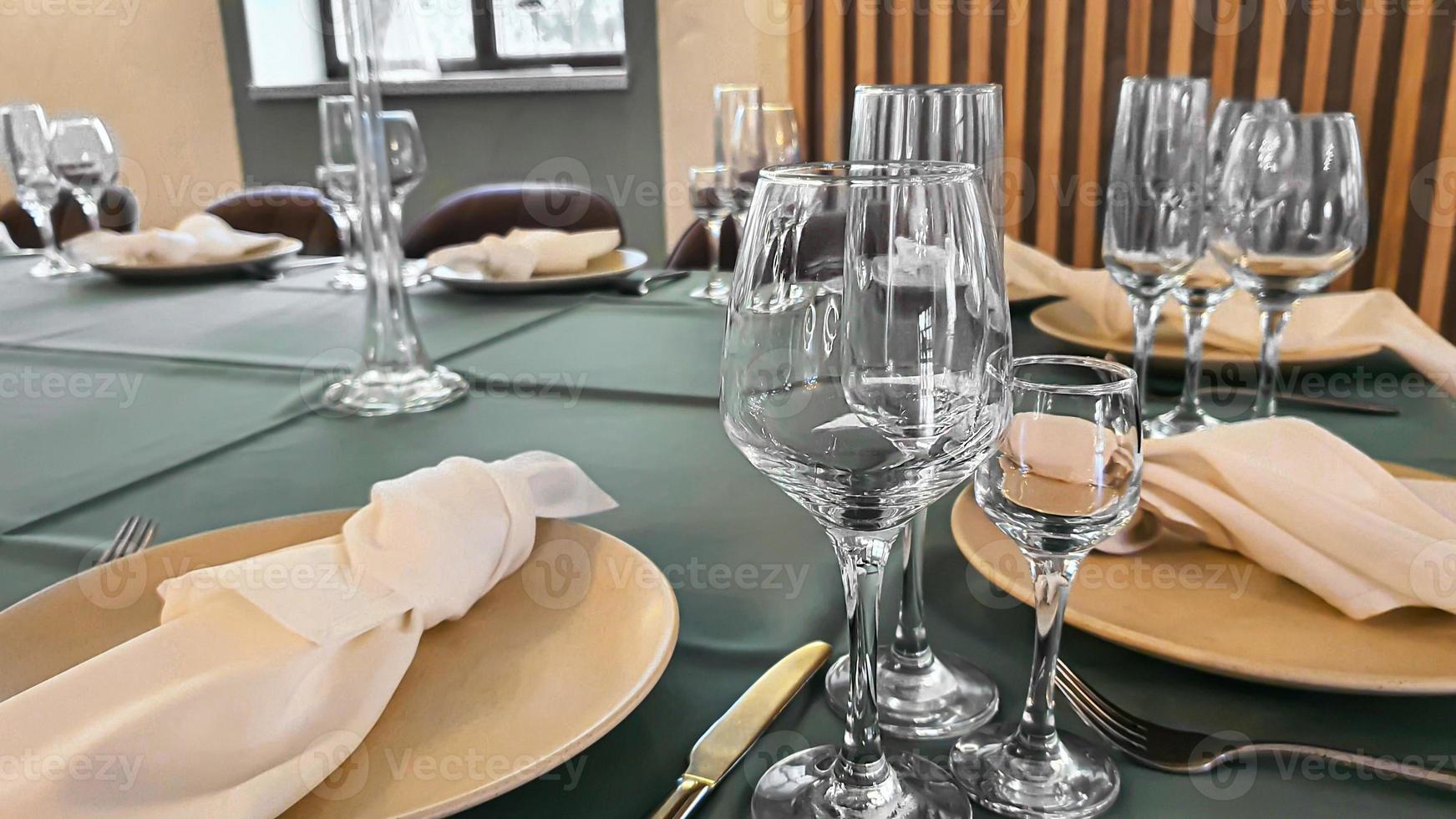 Festive table setting in the restaurant. Wedding preparations. Selective focus. photo