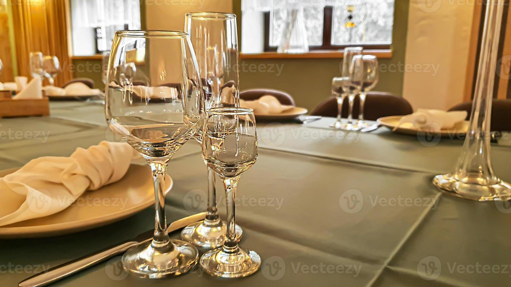 Festive table setting in the restaurant. Wedding preparations. Selective focus. photo