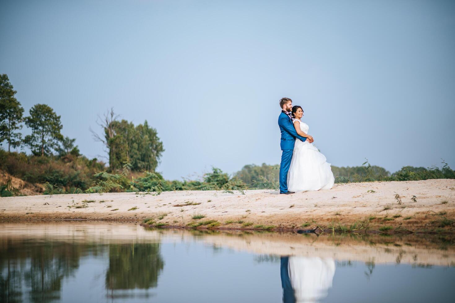 Asian bride and Caucasian groom have romance time and happy together photo