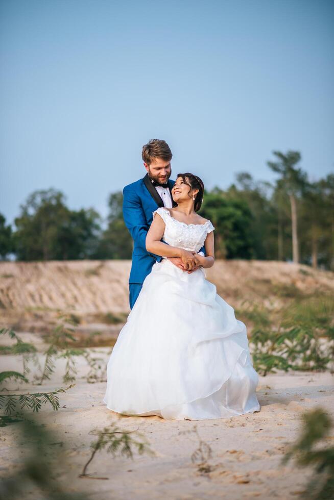 Asian bride and Caucasian groom have romance time and happy together photo