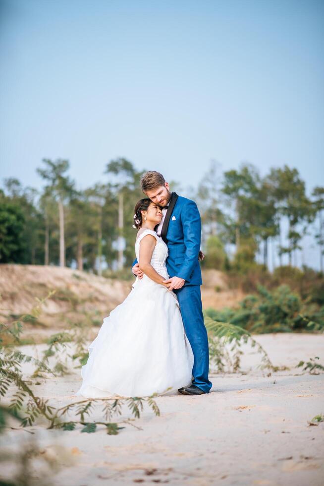 Asian bride and Caucasian groom have romance time and happy together photo