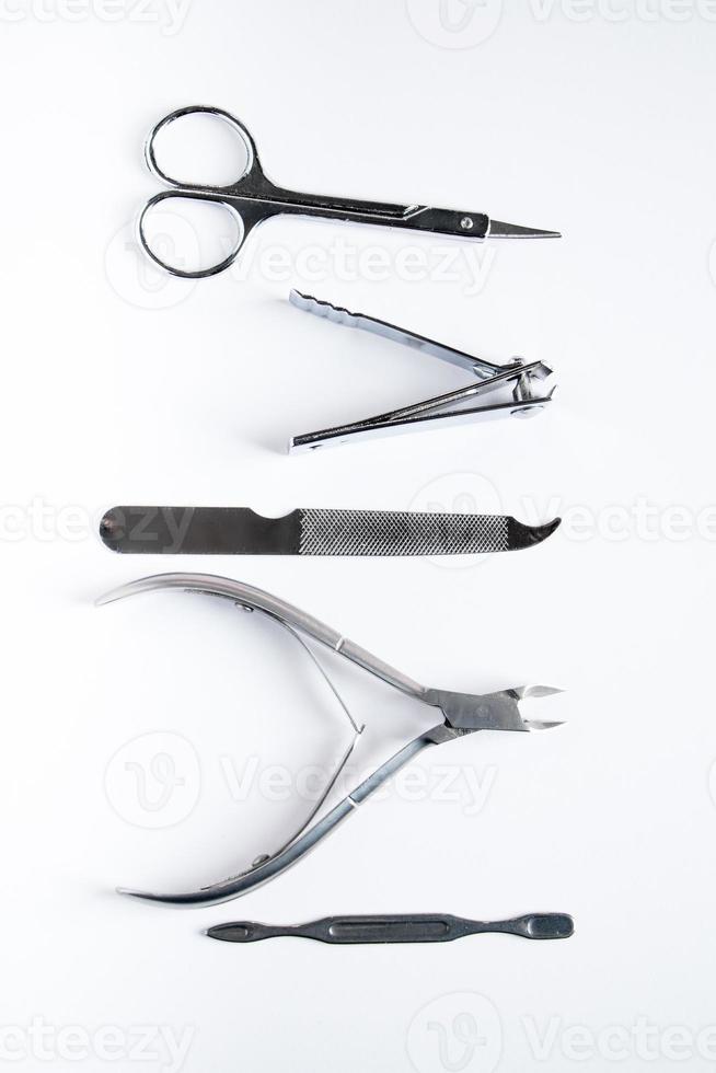 Tools for manicure and nail care on white background. photo