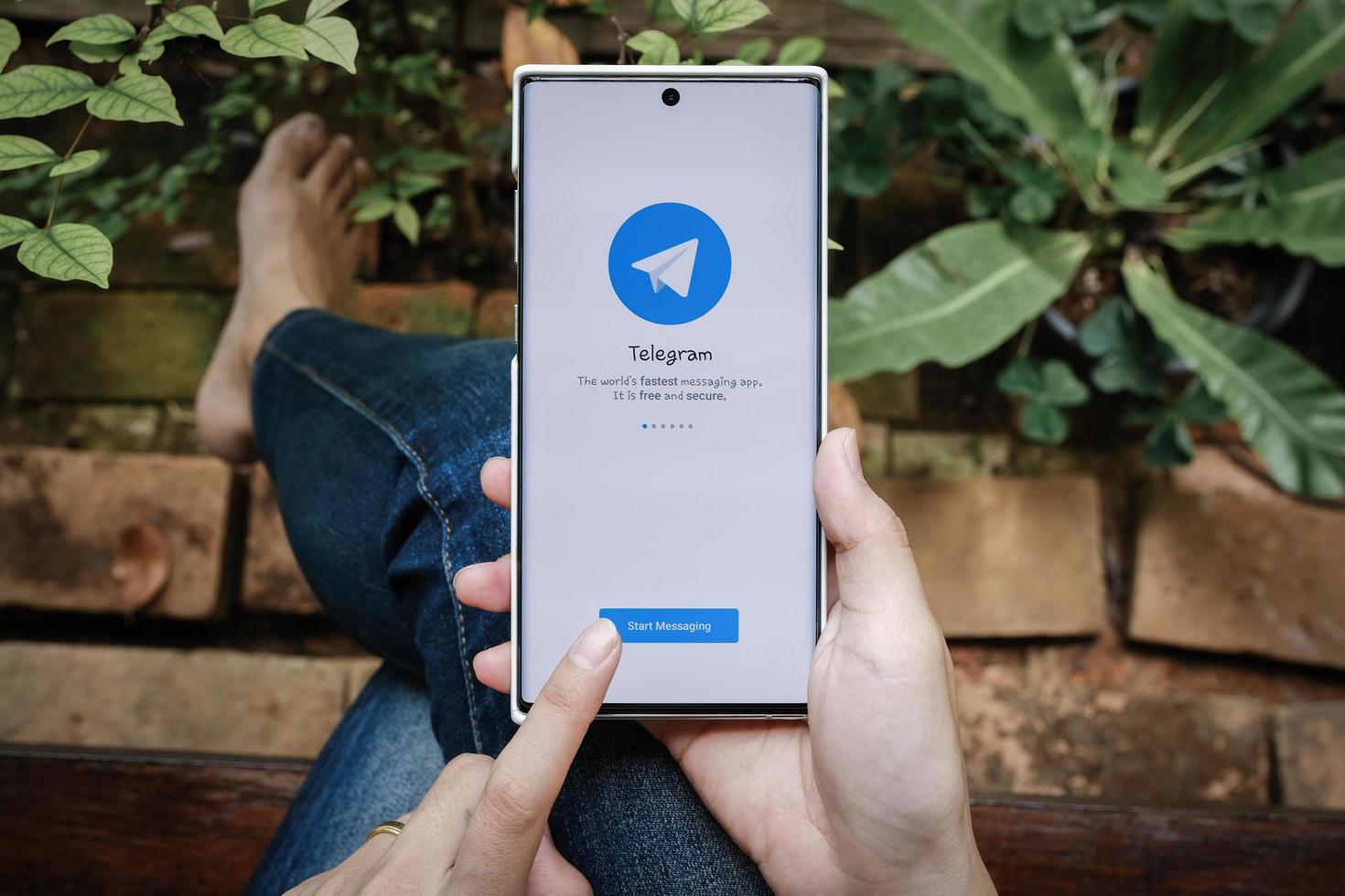Chiangmai, Thailand July 09 2021 , Telegram application icon smartphone mobile close-up. Telegram app icon. Telegram is an online social media network. photo