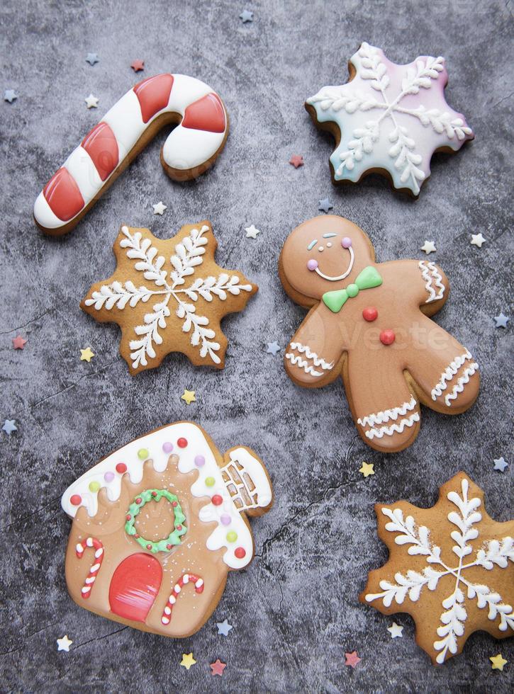 Christmas gingerbread cookies on black concrete background photo