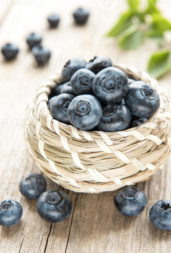 Blueberries on wooden background photo