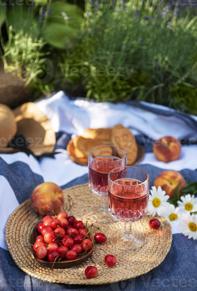 Set for picnic on blanket in lavender field photo