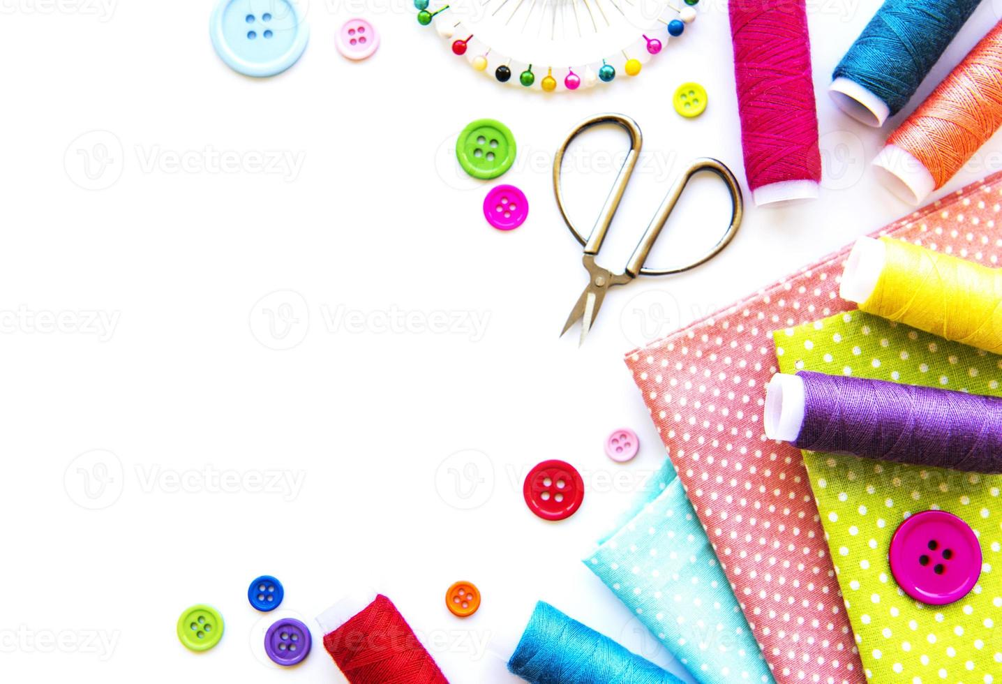 Sewing accessories on a white background photo