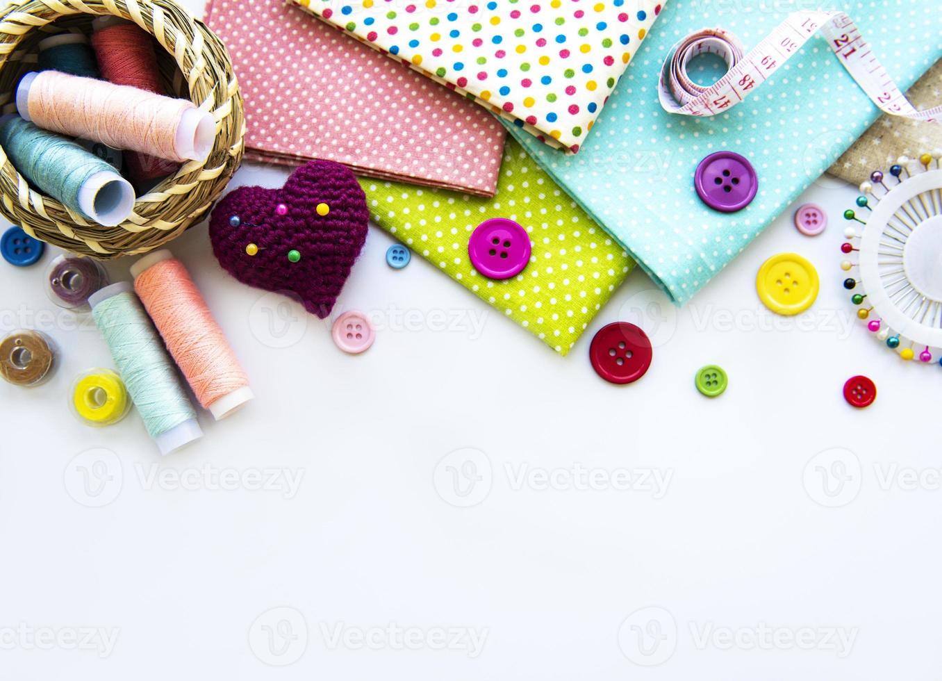 Sewing accessories on a white background photo