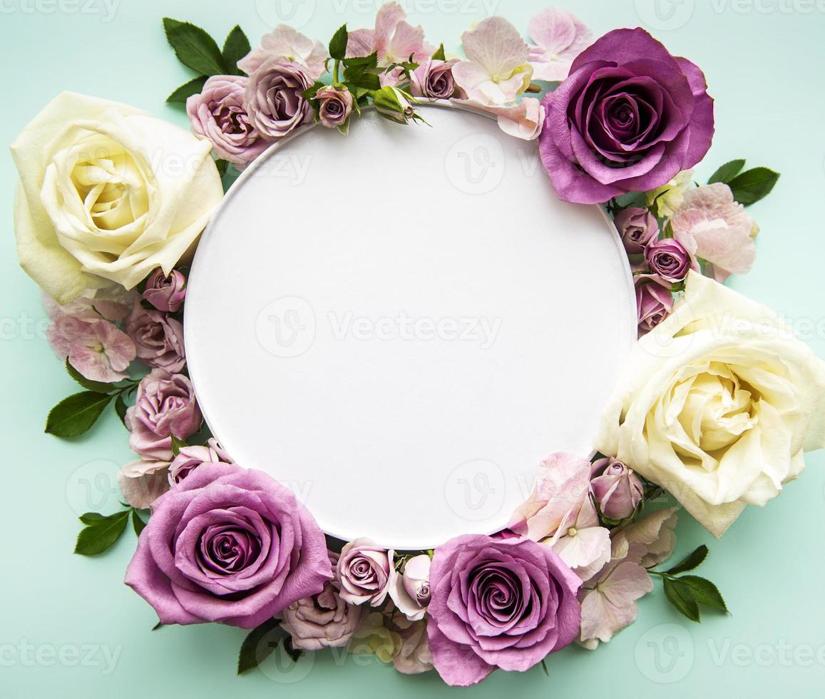 Pink flowers in round frame with white circle for text photo