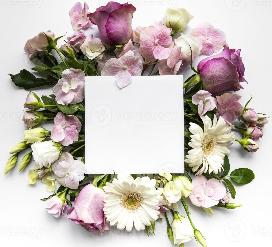Pink flowers in  frame with white square for text photo