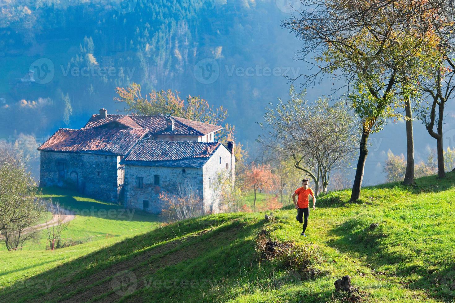 Old hamlet of Italian wings with mountain runner photo