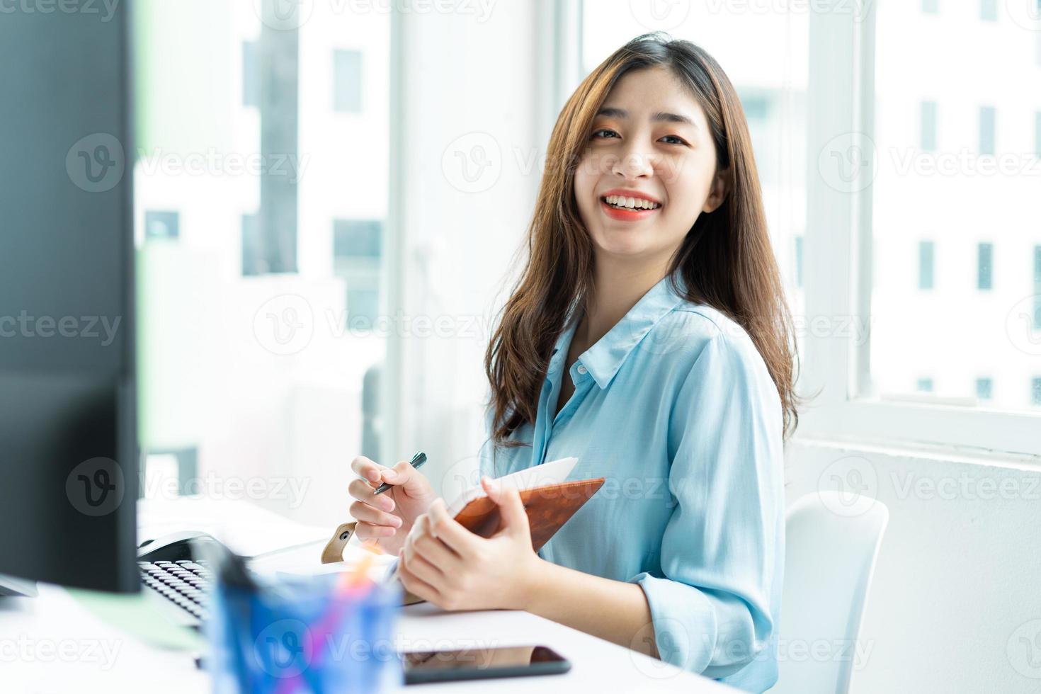 Portrait of a beautiful smiling young businesswoman photo