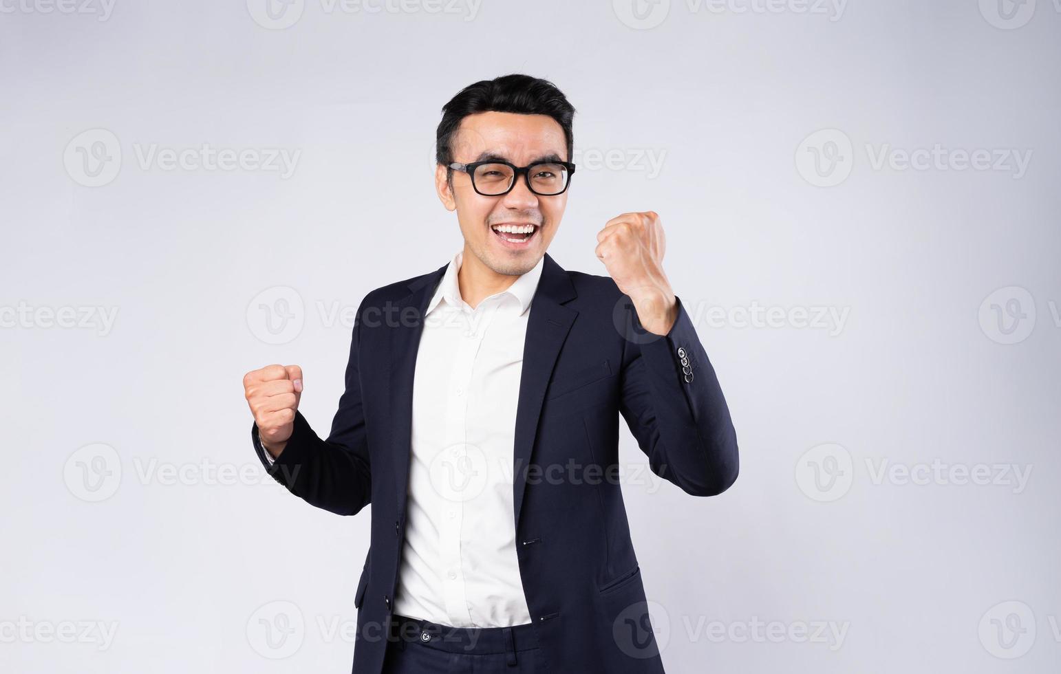 Portrait of business man wearing suit, isolated on white background photo